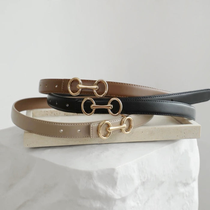 Three PU leather Linked Loop Belts in brown, black, and khaki with gold-tone buckles.