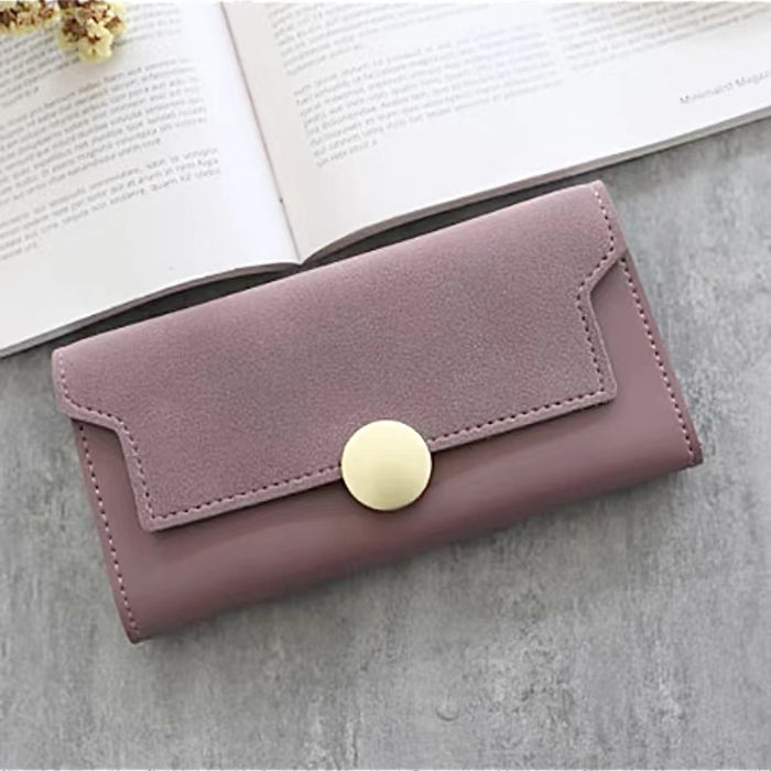 Flat lay of Long Wallet With Nubuck Leather Flap in pink, great for everyday carry and travel.
