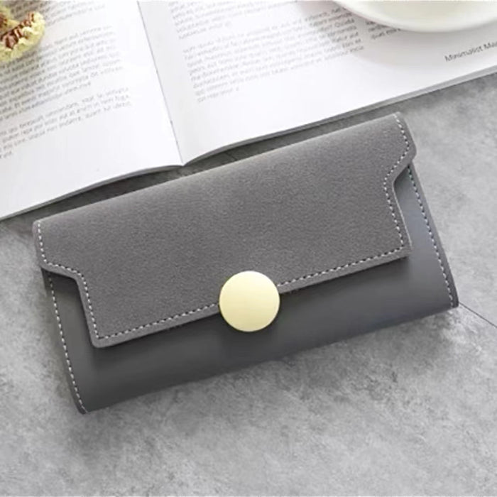 Angled view of Long Wallet With Nubuck Leather Flap in gray, easy for organizing cards and cash.