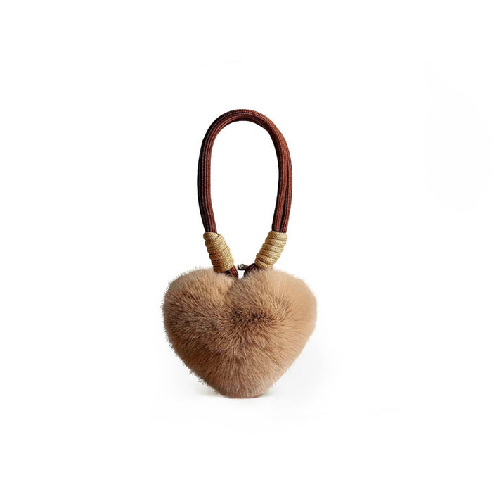 Close-up of Love Fluff Bag Charm in khaki, ideal for travel and daily use.