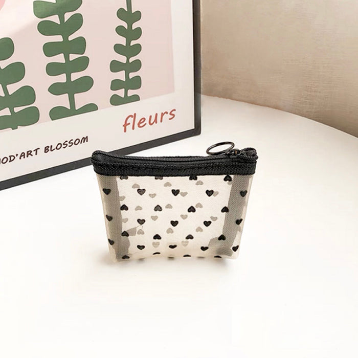 Close-up of a mini heart print organza bag; highlighting the flocked heart details and durable material.