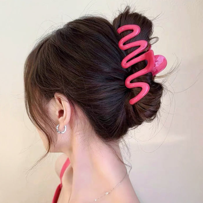 Model wearing Macaron Wave Hair Claw in pink, ideal for quick updos.