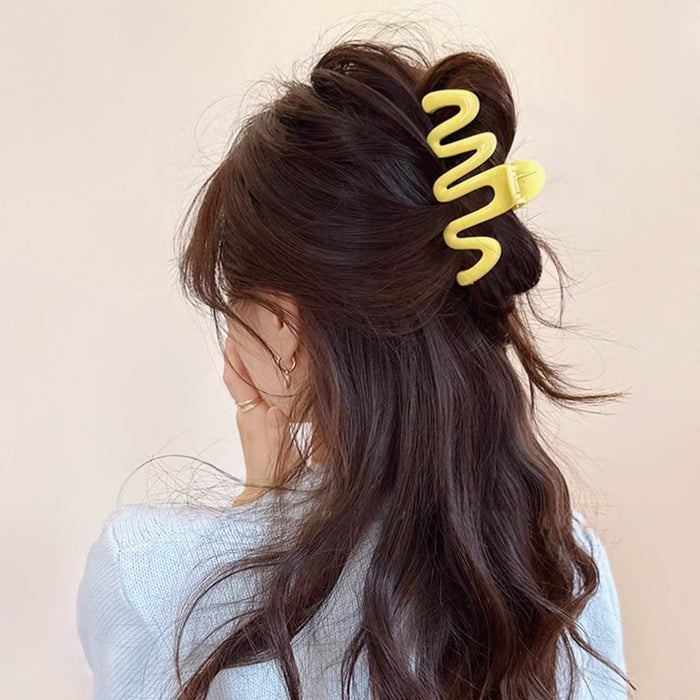 Model wearing Macaron Wave Hair Claw in yellow, easy for workdays and special occasions.