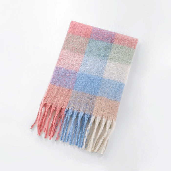 Flat lay of Soft pink and blue gradient plaid scarf with a fuzzy marshmallow texture, easy for travel packing.