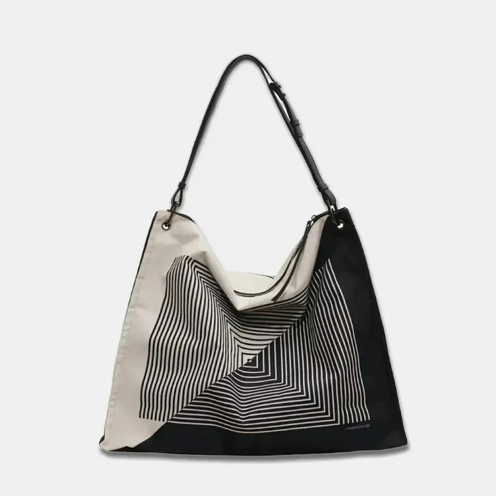 Black and white maze print tote made of lightweight nylon.