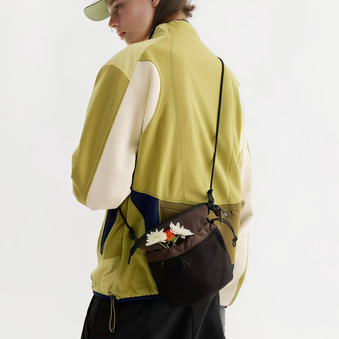 Model carrying a brown nylon  bag as crossbody, easy for commuting and weekends.