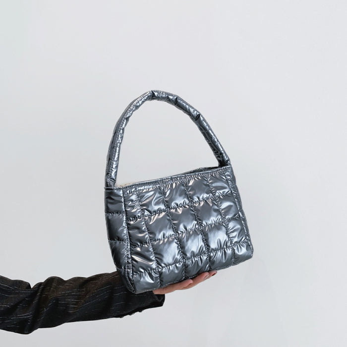 Angled view of Metallic Glow Quilted Bag in gray, great for everyday carry and travel.
