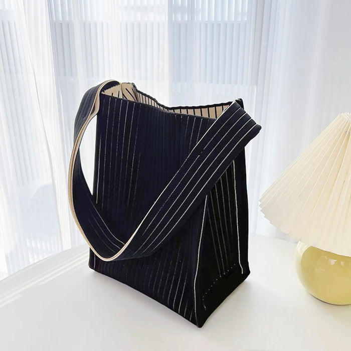 Close-up of Milk Carton Textured Woven Tote Bag in black, great for everyday carry and travel.