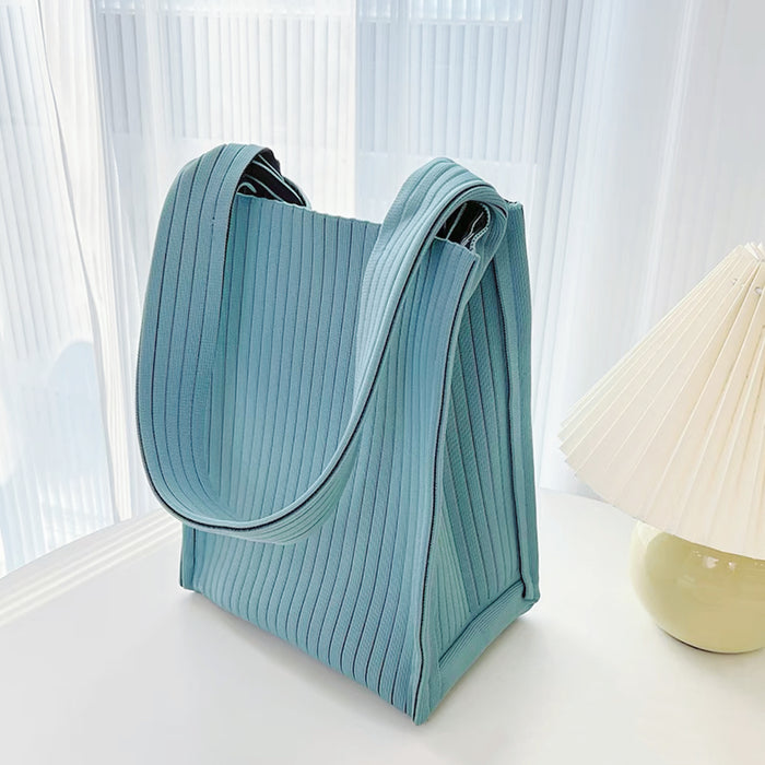 Close-up of Milk Carton Textured Woven Tote Bag in blue, easy for commuting and weekends.