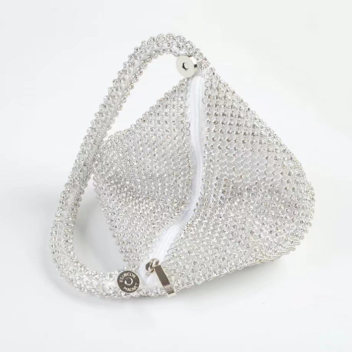 Top view of Mini Diamond Party Handbag in silver, showcasing the detail of the zipper.