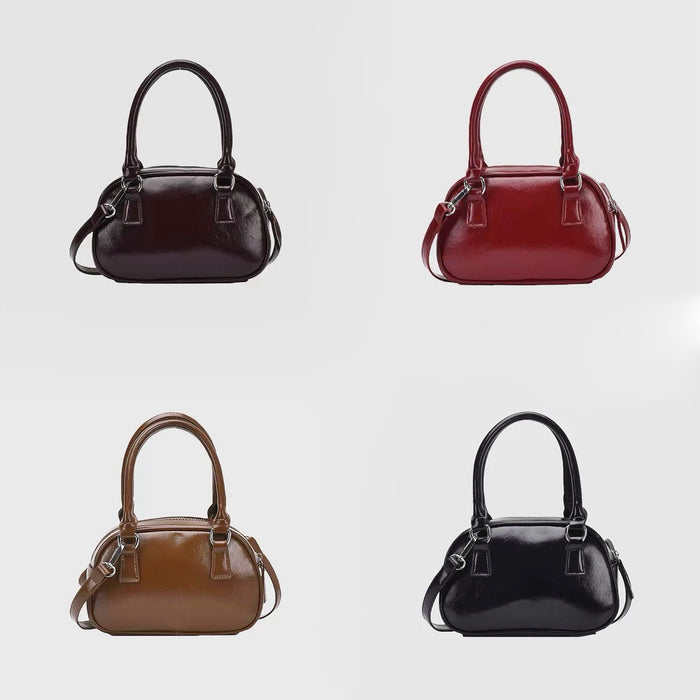 Front view of Four mini PU leather bowling bags in brown, red, tan, and black, with grab handles and detachable.