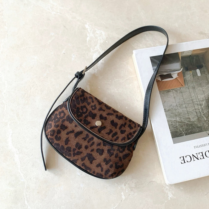 Front view of Mini Leopard Suede Saddle Bag, ideal for errands and gifting.