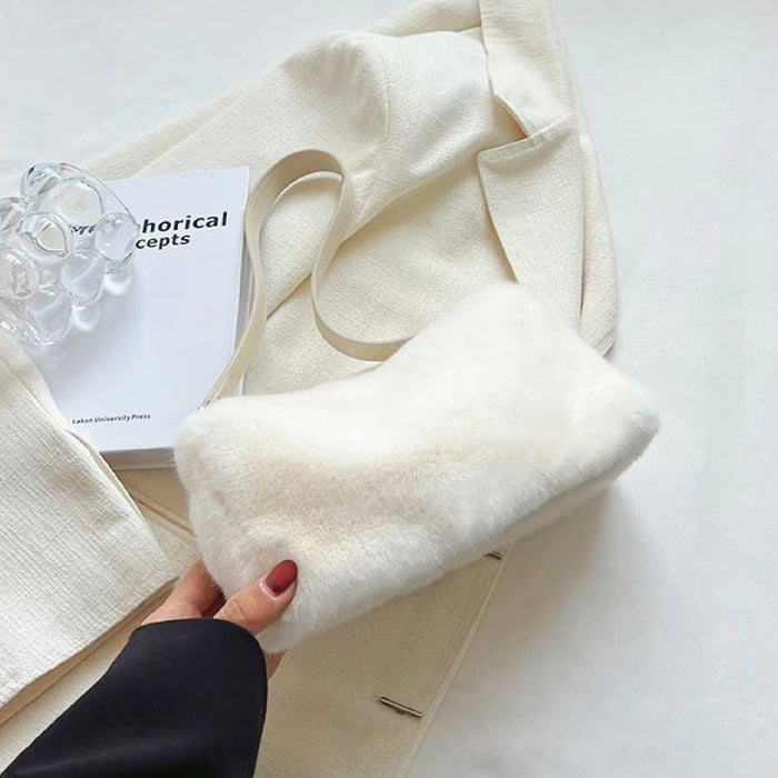 Close-up of Mini Shearling Baguette Bag in white, easy for commuting and weekends.