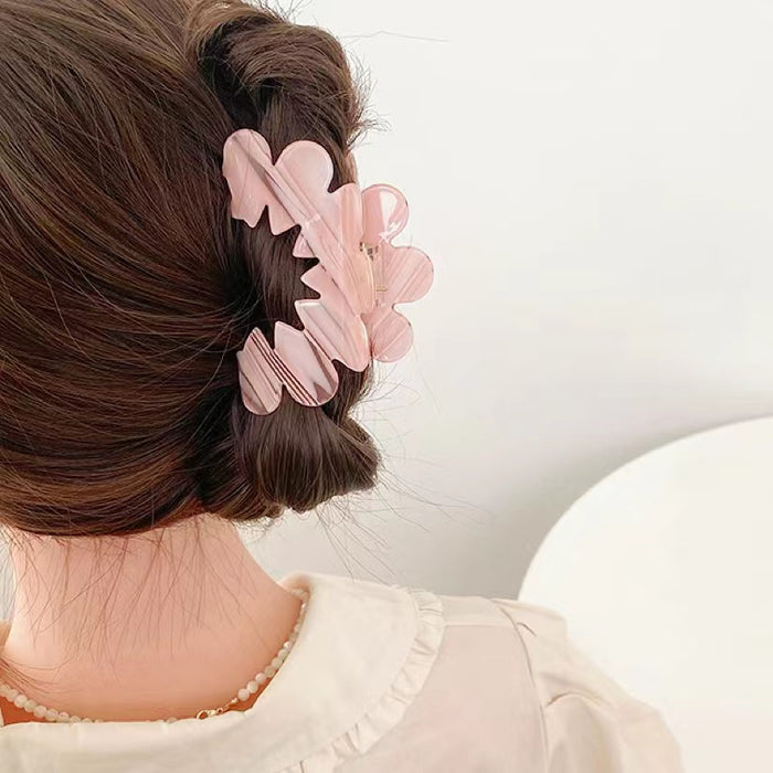 Model wearing Moon Hair Claw in pink, easy for workdays and special occasions.