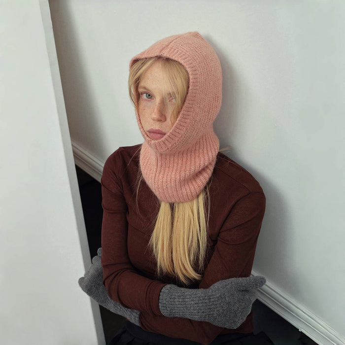 Side view of pink Morandi Toned Knit Balaclava Hat on a model, featuring a soft and soothing color palette.
