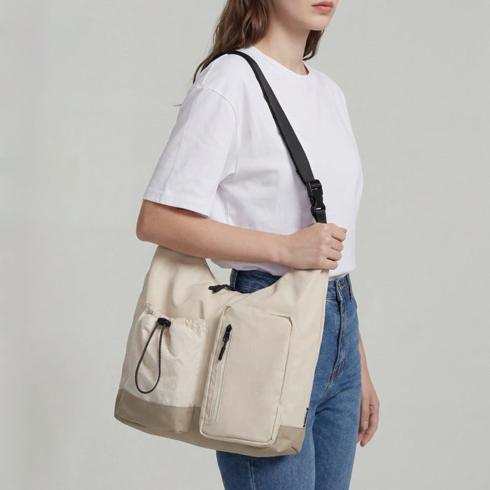 Model carrying the khaki multi-pocket bag on shoulder, functional daily lifestyle view.