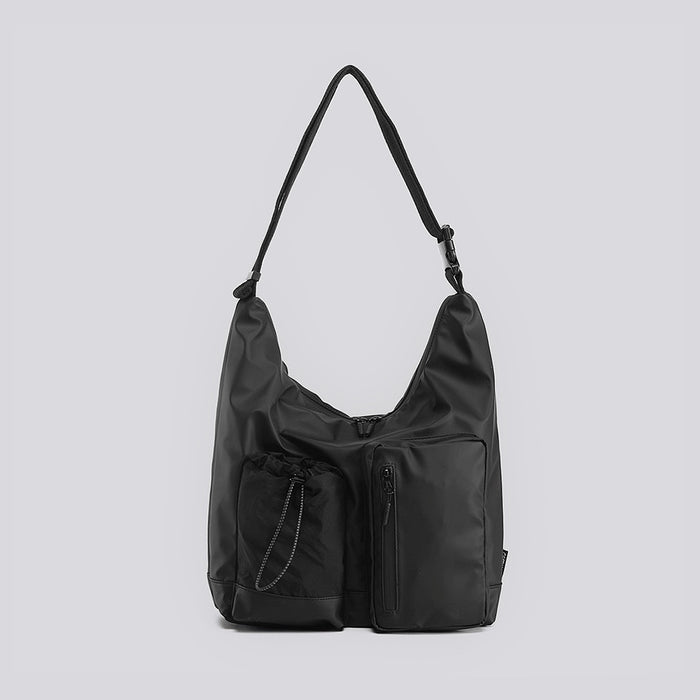 Front view of the black multi-pocket nylon bag,  showcasing durable and water-resistant fabric.