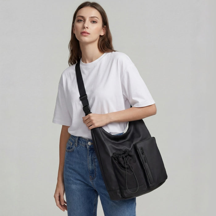 Model wearing the multi-pocket nylon crossbody bag in black, demonstrating the adjustable fit.