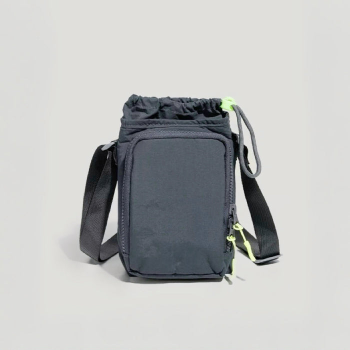 A minimalist grey water bottle designed to hold water bottle and smartphone for outdoor activities.