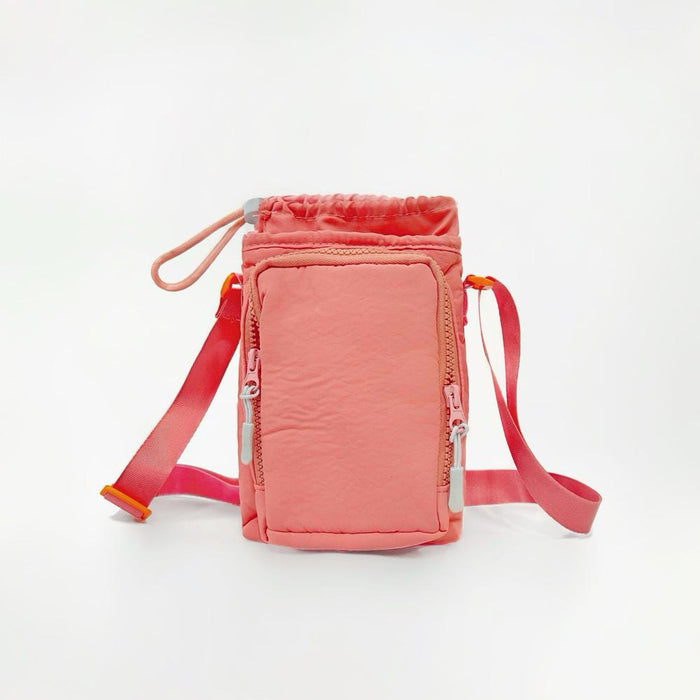 Versatile coral pink water bottle carrier with an adjustable strap, suitable for both adults and kids during family outdoor trips.