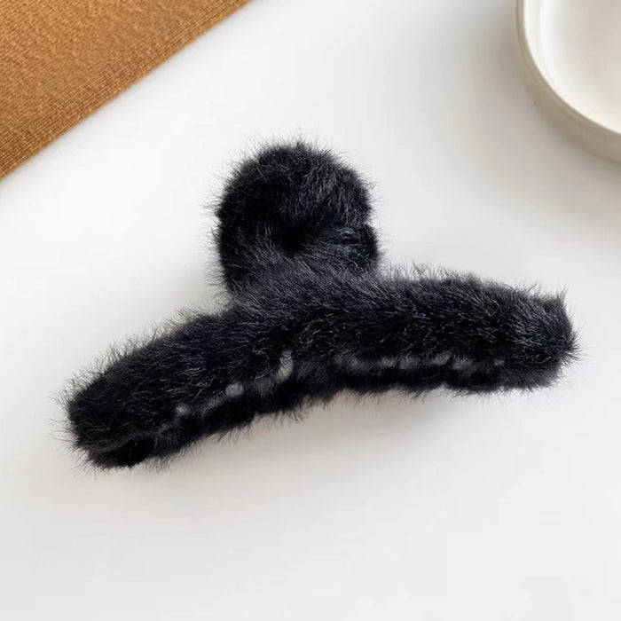 Close-up of black Plush Hair Claw, easy for workdays and special occasions.