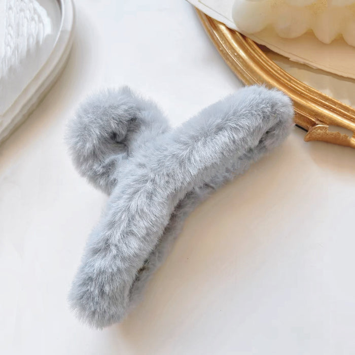 Folded view of Multicolor Plush Hair Claw in gray, ideal for quick updos and ponytails.