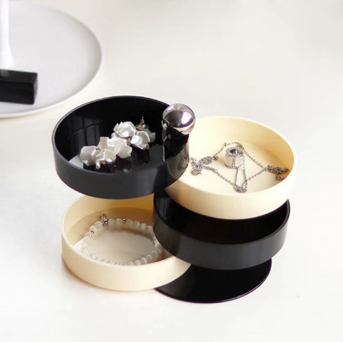 Detailed view of  black and white Multilayer Storage Box with each layer fanning out in an alternating pattern.