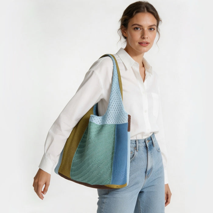 Model carrying the blue, green, and brown crochet shoulder bag, showcasing a relaxed casual style.