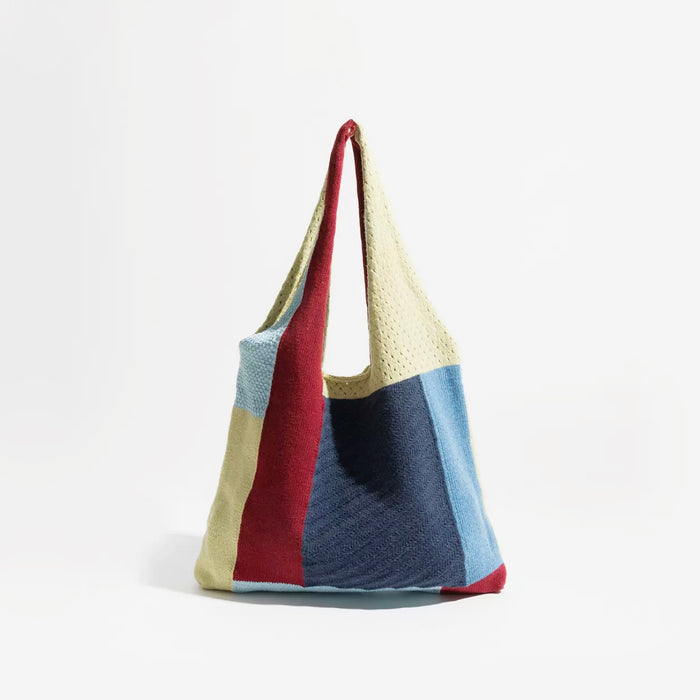 Front view of the woven tote bag variant featuring deep red, navy blue, and cream white color-block knit panels.