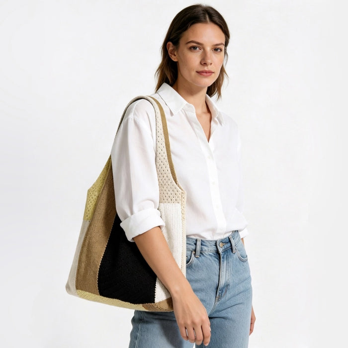 Model showcasing the neutral beige and brown woven crochet bag over her shoulder against a minimalist white background.