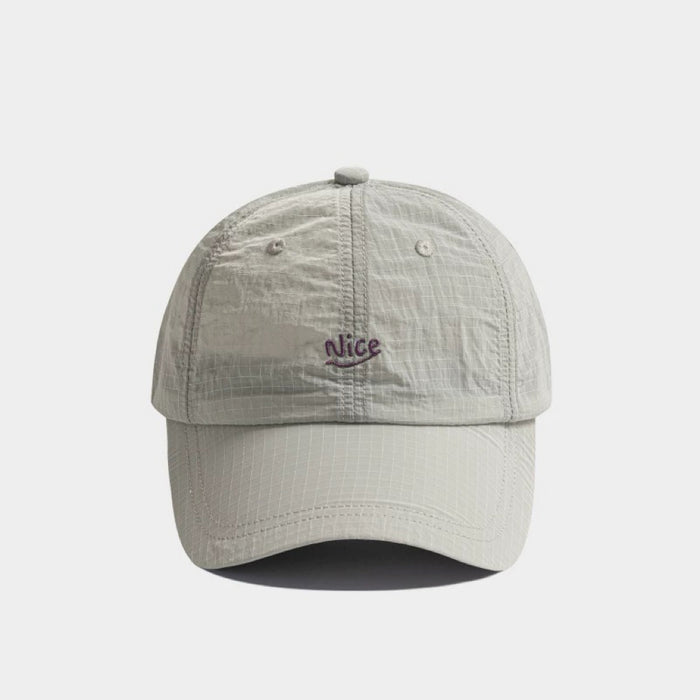 Front view of grey Nice Ultralight Quick Dry Cap, highlighting a sleek professional look with high-tech fabric.