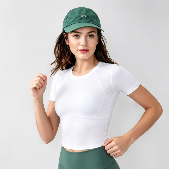 Model wearing the dark green techwear baseball cap, showcasing utilitarian gorpcore style.