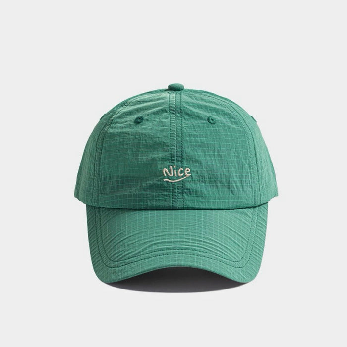 Front view of green Nice Ultralight Quick Dry Cap, showcasing a flexible brim and sweat-wicking properties.