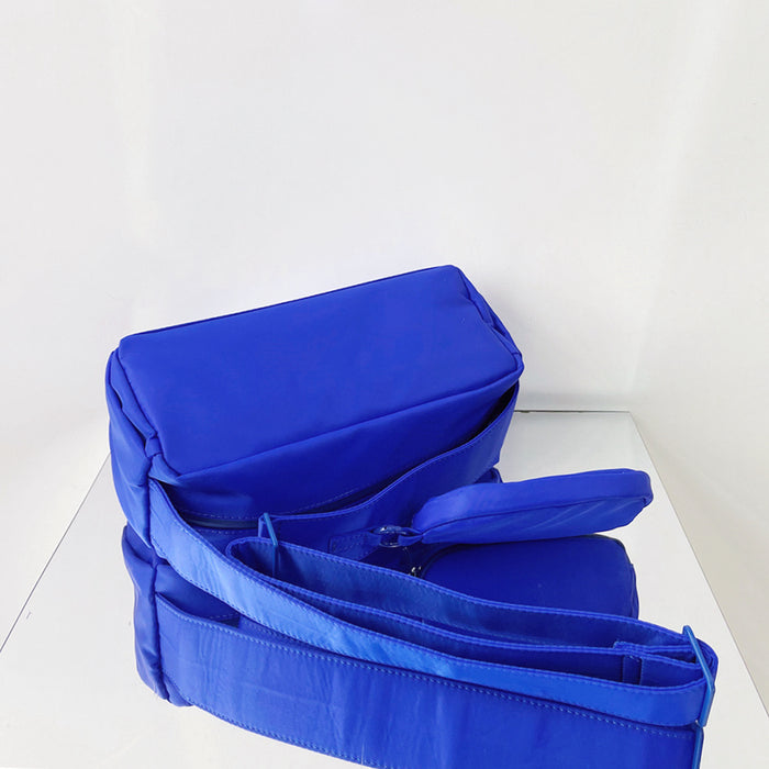 Front view of Nylon Brick Cassette Crossbody Bag in blue, ideal for errands and gifting.