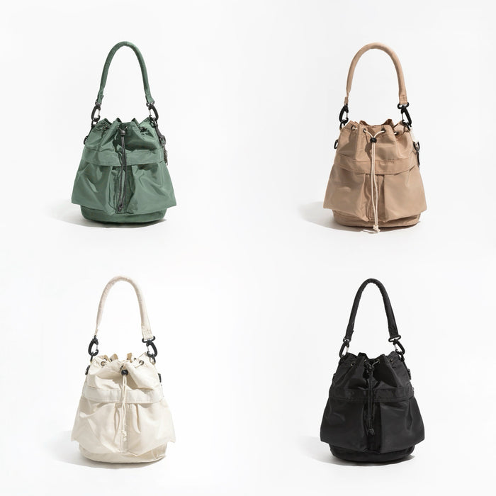 Four colors of the nylon drawstring bucket bag including olive green, khaki, white, and black.
