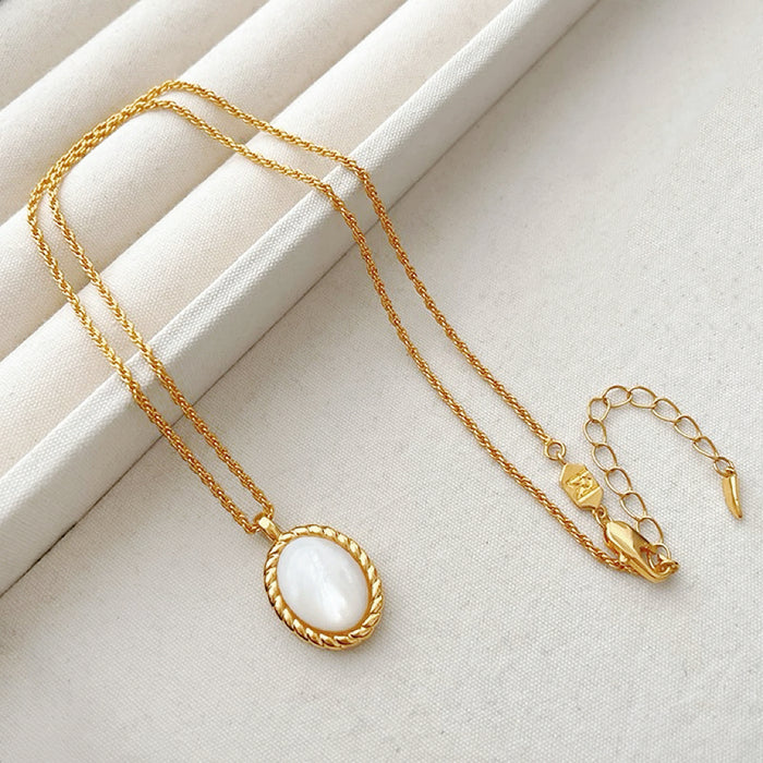 Flat lay of Ocean Breeze Necklace with Gold Jade, great for everyday outfits.