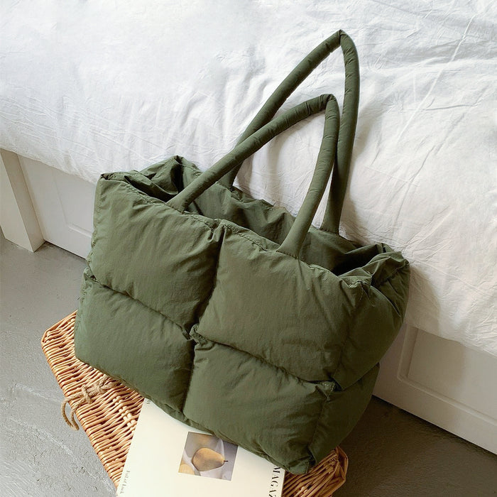 Close-up top view of the olive green padded tote bag, showcasing its soft texture.