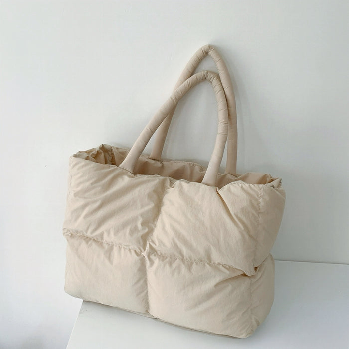 Front view of the apricot padded tote bag showcasing its square quilted texture.