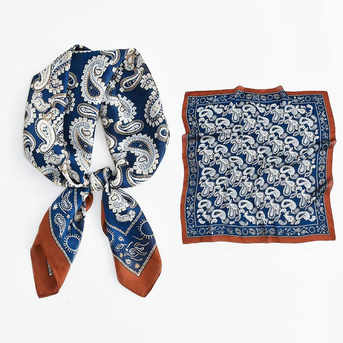 Set of blue and white silk-blend scarves with intricate paisley motifs.