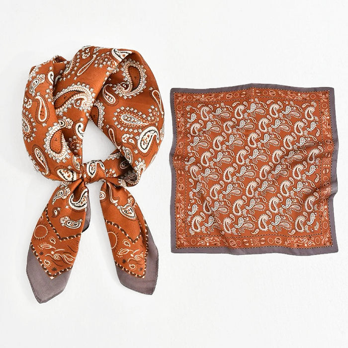 Rich brown and orange paisley scarf with vintage-inspired motifs adding sophisticated accent to fashion gatherings.