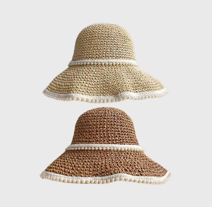 Woven straw sun hats in beige and khaki with elegant pearl-beaded bands for vacations.