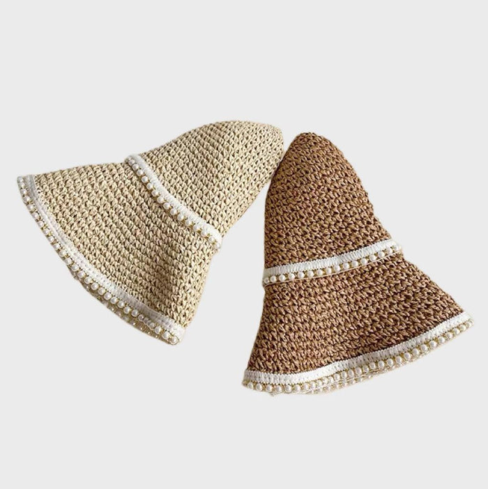 Flexible and foldable straw brim design highlighting travel-friendly convenience and artisanal charm.
