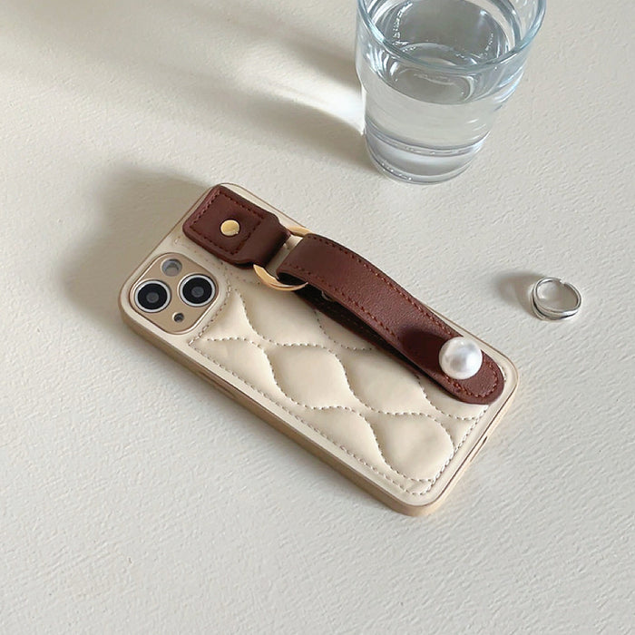 Front view of Pearl Wristband Case. Elegant integrated pearl-beaded strap for secure carry.