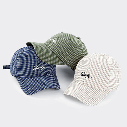 Three cotton plaid chill caps in blue, olive, and beige with Dorle embroidery for a vintage aesthetic.