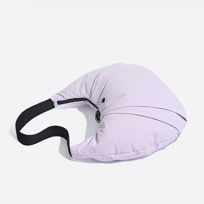 Close-up of Light purple nylon pleated crescent shoulder bag with black strap and zip-top fastening.