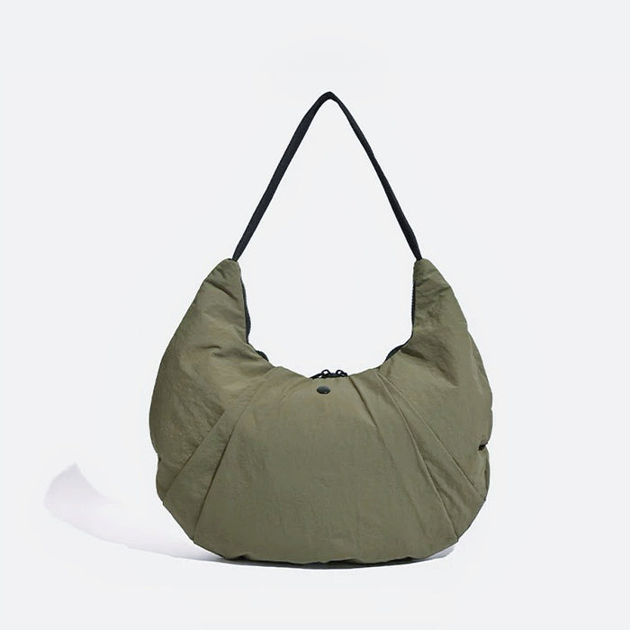 Folded view of Pleated Crescent Shoulder Bag in olive green, easy for commuting and weekends.