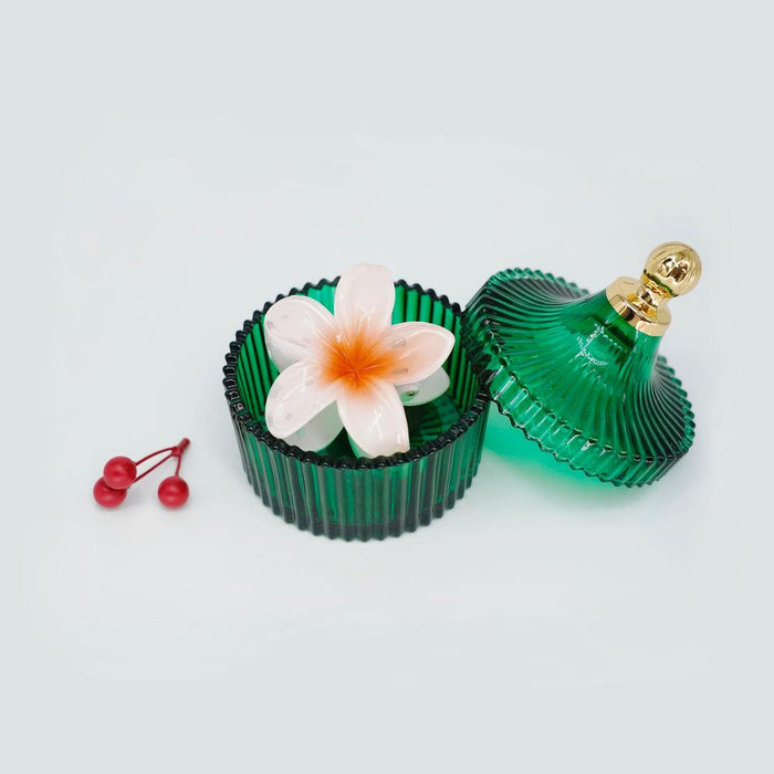 Folded view of Plumeria Hair Claw in orange, ideal for quick updos and ponytails.