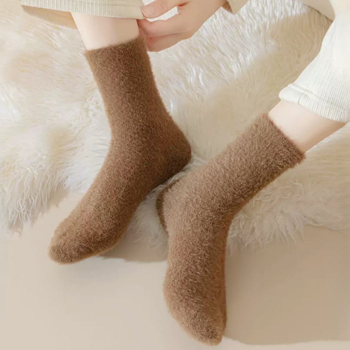 Model wearing a pair of tan Plush Cozy Socks, easy for travel days and daily comfort.