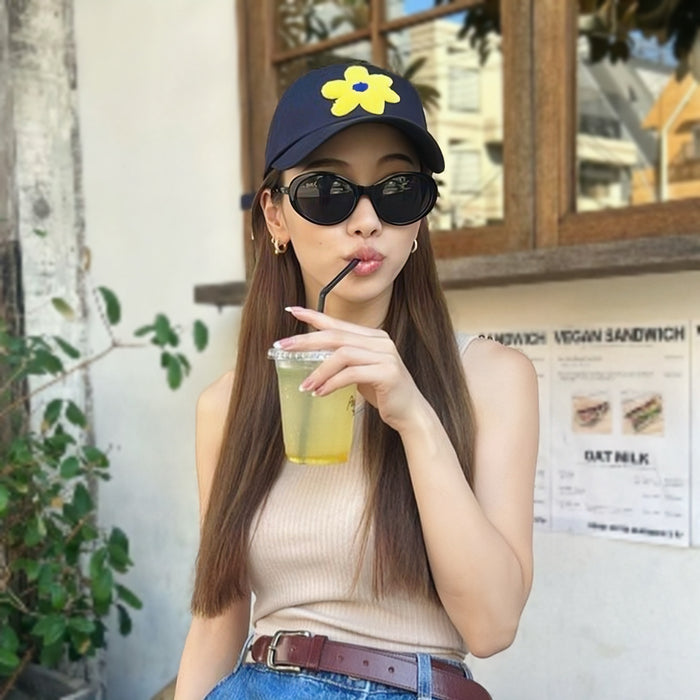 Model wearing the navy blue flower corduroy cap for a casual look.