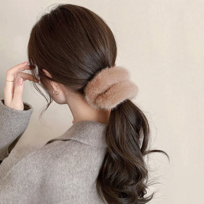 Model wearing Plush Scrunchie in tan, easy for workdays and special occasions.